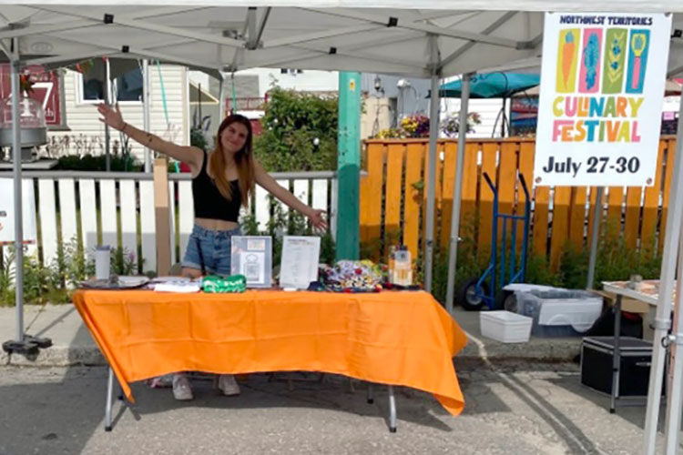 Linnea Azzolini at festival booth