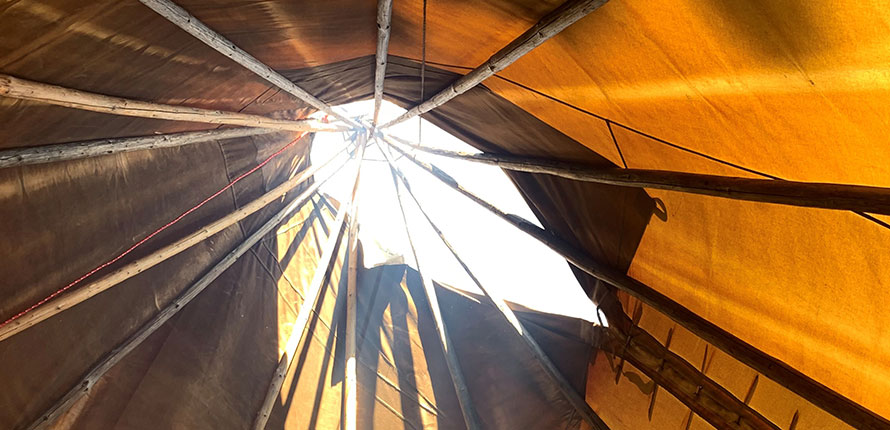 Inside of a teepee, view from the bottom