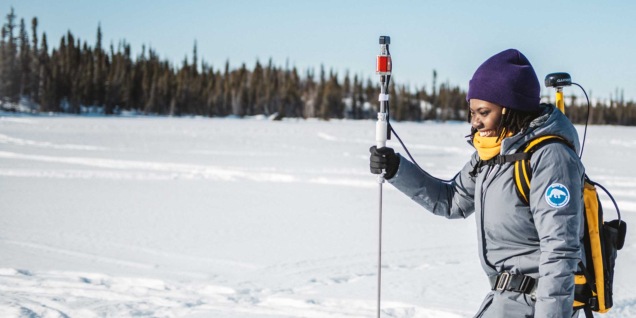 student on ice lake