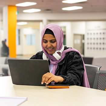 Student working at a laptop