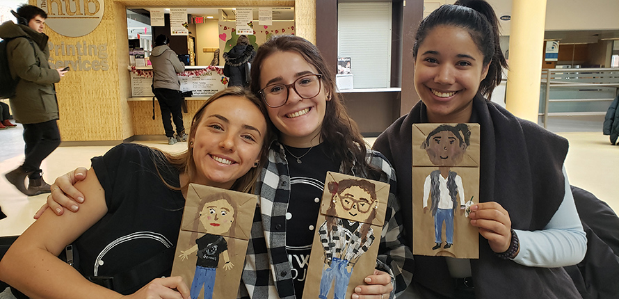 Members of GenWell Project Laurier holding crafts