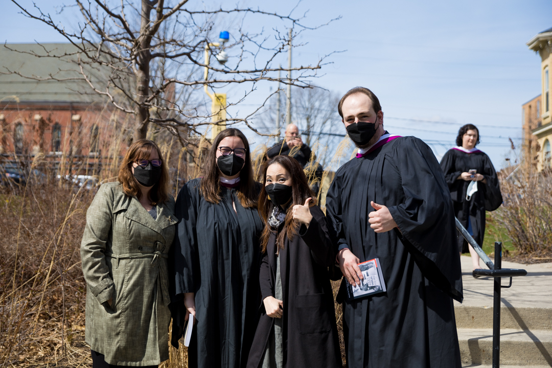 graduates celebrate with faculty