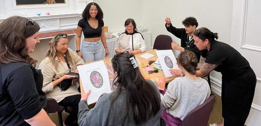 A group of students beading.